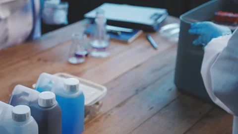 Biochemistry, scientist pipetting a sample into a test tube during an exper.. Stock Footage 290060789