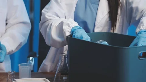Biochemistry, scientist pipetting a sample into a test tube during an exper.. Stock Footage 290060813