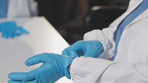 Biochemistry, scientist pipetting a sample into a test tube during an exper.. Stock Footage 290060885