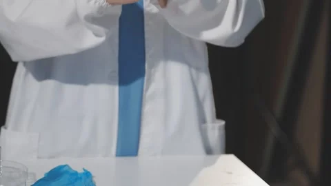 Biochemistry, scientist pipetting a sample into a test tube during an exper.. Stock Footage 290060916