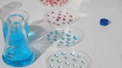 Biochemistry, scientist pipetting a sample into a test tube during an exper.. Stock Footage 290061230