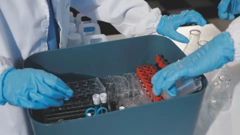Biochemistry, scientist pipetting a sample into a test tube during an exper.. Stock Footage 290062096