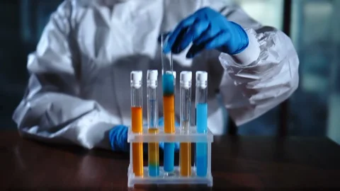 Biochemistry technician analyzing samples in test tubу in the modern laboratory Stock Footage 95090447