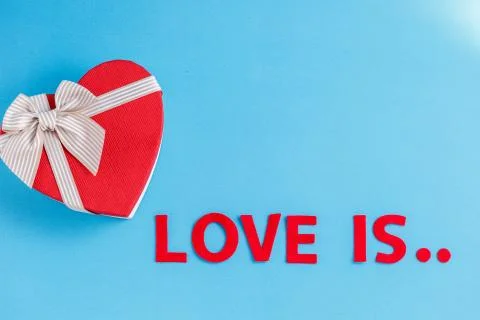 Biodegradable cardboard gift box in the shape of a heart and an inscription l Stock Photos