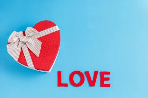Biodegradable cardboard gift box in the shape of a heart and an inscription l Stock Photos