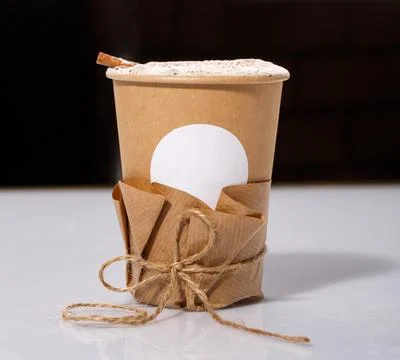 Biodegradable Disposable Cup with blank white circle for text containing a ho Stock Photos