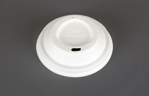 Biodegradable disposable tableware plates, glasses and spoons with forks on.. Stock Photos
