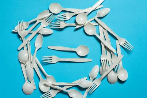 Biodegradable eco-friendly disposable tableware on a blue background. Stock Photos