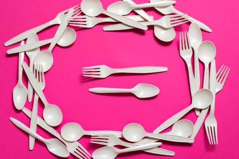 Biodegradable eco-friendly disposable tableware on a pink background. Stock Photos