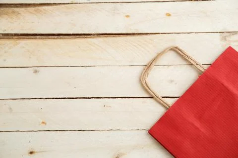 Biodegradable environmentally friendly cardboard bag on wooden background Stock Photos