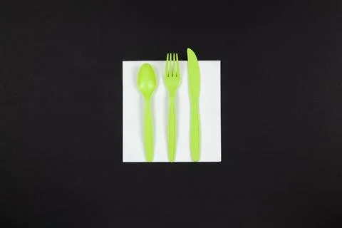 Biodegradable reusable recyclable green fork, spoon, knife made from corn sta Stock Photos