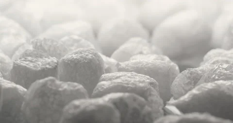 Biodegradable starch foam peanuts tumbling in slow motion, Ecofriendly packaging Stock Footage 147493263