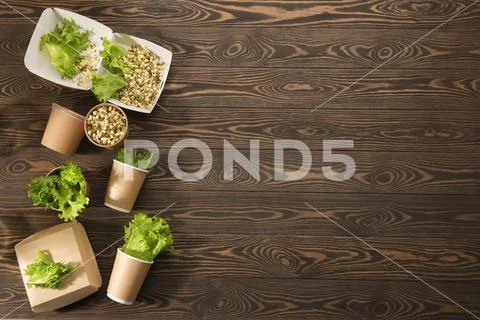 Biodegradable tableware and greens. The concept of zero waste. Stock Photos
