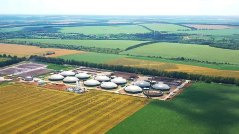 Biogas complex on field in summer. Enterprise for processing organic waste.  Stock Footage 157385320