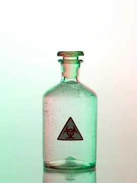 Biohazard bottle with green light Stock Photos