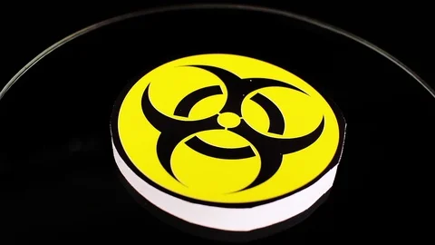 Biohazard sign closeup texture video on rolling rotating looping plate Stock Footage 104327757