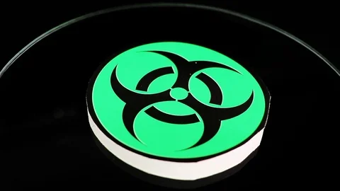 Biohazard sign closeup texture video on rolling rotating looping plate Stock Footage 104328010