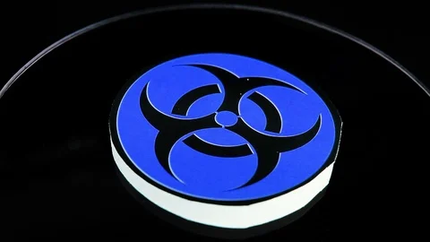 Biohazard sign closeup texture video on rolling rotating looping plate Stock Footage 104328089