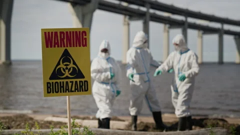 Biohazard Sign with Scientists Investigating Ecological Disaster Stock-Footage 344719062