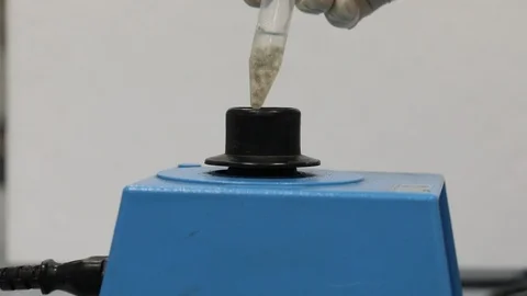 Biological sample in vortex-stirred test tube Stock Footage 127475825