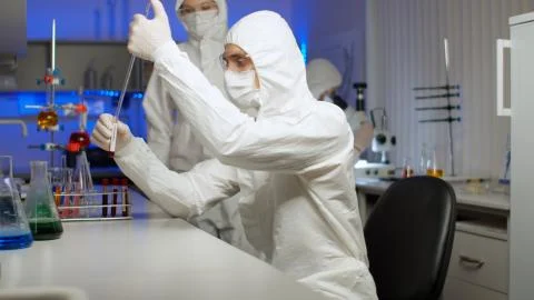 Biologist examining a virus sample in laboratory Stock Photos