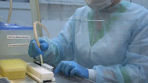 Biologist, scientist in the laboratory using a pipette or dropper for liquid Stock Footage 121753895