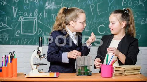 Biology lab. Happy Genius. Chemistry research in laboratory. Little girls Stock Photos