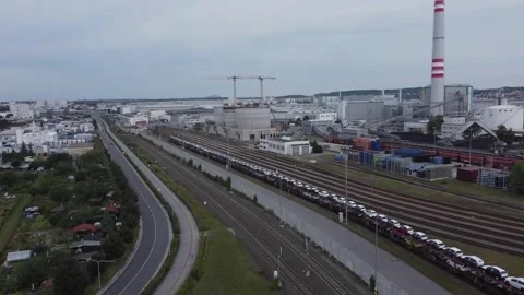 Biomass Storage Site and Train with New Cars Near Industrial Facility Editorial Stock Footage 313658111