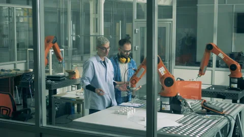 Bionic arm in motion under supervision of software experts Stock Footage 135585955