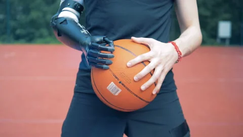 Bionic hand with a ball, close up. Human with a robot arm. Stock Footage 94623361