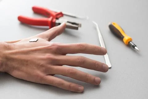 Bionic microchip inside human body - future technology and cybernetics concept. Stock Photos