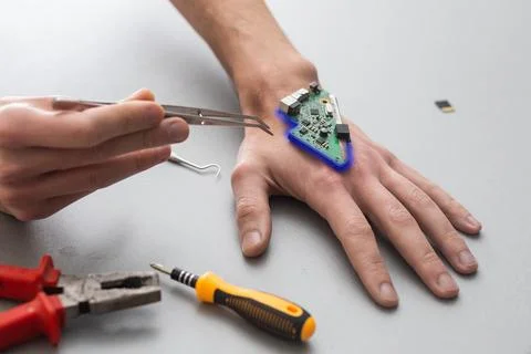Bionic microchip inside human body - future technology and cybernetics concept. Stock Photos
