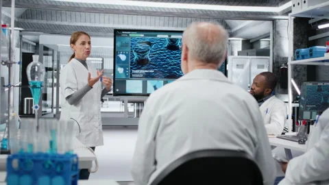 Biotechnology expert in lab presenting innovative DNA sequencing project Stock Footage 327417697