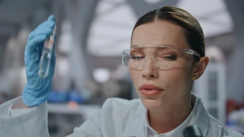 Biotechnology specialist developing medicines holding test tube close up. 스톡 동영상 254608202