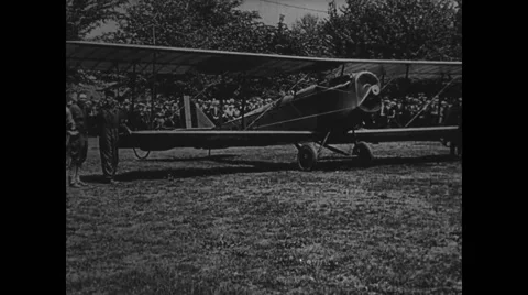 Biplane getting ready to take off and arrival of US airmail service van Stock Footage 43319886