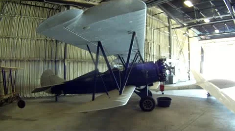 Biplane in Hangar Stock Footage 21370241