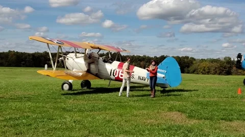 Biplane loads passengers at the Flying Circus Show, Bealeton, VA Stock Footage 141479830