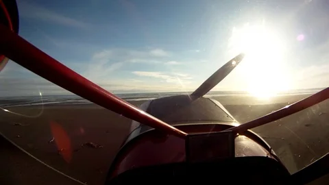 Biplane parked on the beach during sunset Stock-Footage 83183968