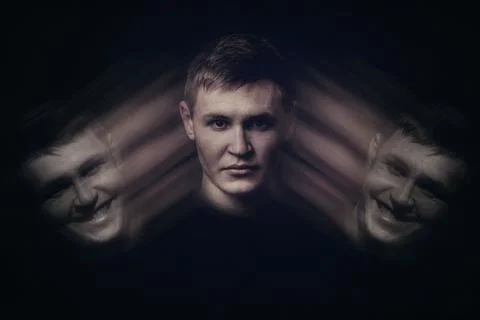 Bipolar young man with split personality and emotional disorder, hiding the r Stock Photos