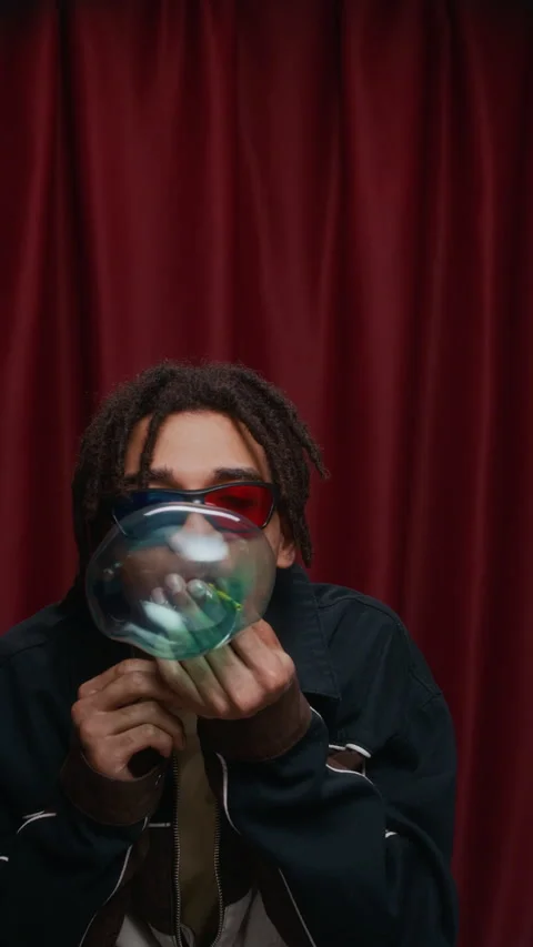 Biracial Guy in 3D Glasses Blowing Soap Bubble in Photo Booth Video stock 310742500