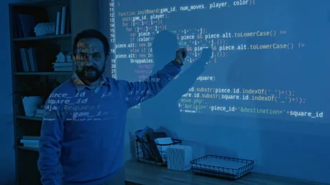 Biracial Male Coding Teacher Explaining Algorithm on Blue Projector Screen Vídeo Stock 306980586