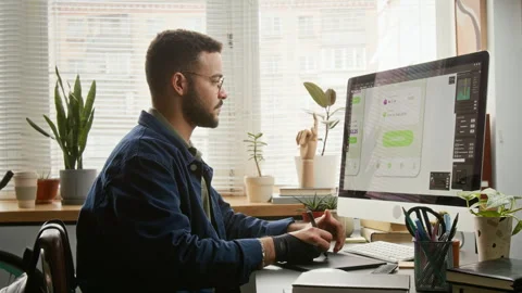 Biracial Male User Experience Designer Drawing Layouts for Mobile App Stock Footage 327902736