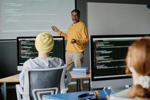 Biracial Man Teaching Computer Science Stock Photos