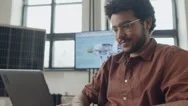 Biracial Man In Wheelchair Working On Computer At Renewable Energy Startup Stock Footage