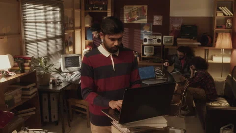 Biracial Programmed Coding on Laptop in Vintage Style Office Stock Footage 263304839