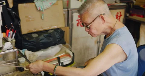 A bird cage artisan, working, a master in making hand made bird cage in Hong Kon Stock Footage 201095692