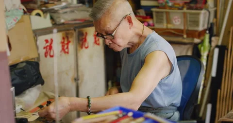 A bird cage artisan, working, a master in making hand made bird cage in Hong Kon Stock Footage 201096964