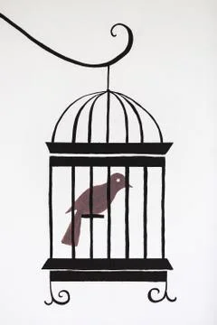 A bird in cage on white wall Stock Photos