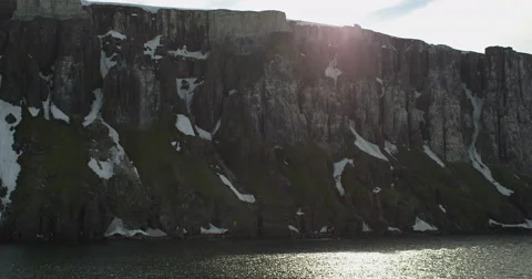 Bird Cliff Wide Static with Sun Glare over Rim Stock Footage 54281590