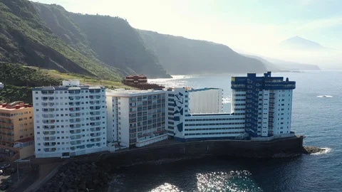 Bird eye flight modern hotel complex on island edge Stock Footage 101962702